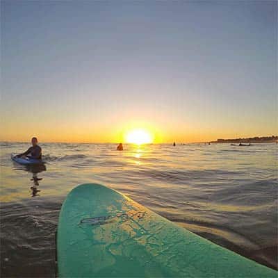 Surfing into the sunset in Carcavelos, Portugal